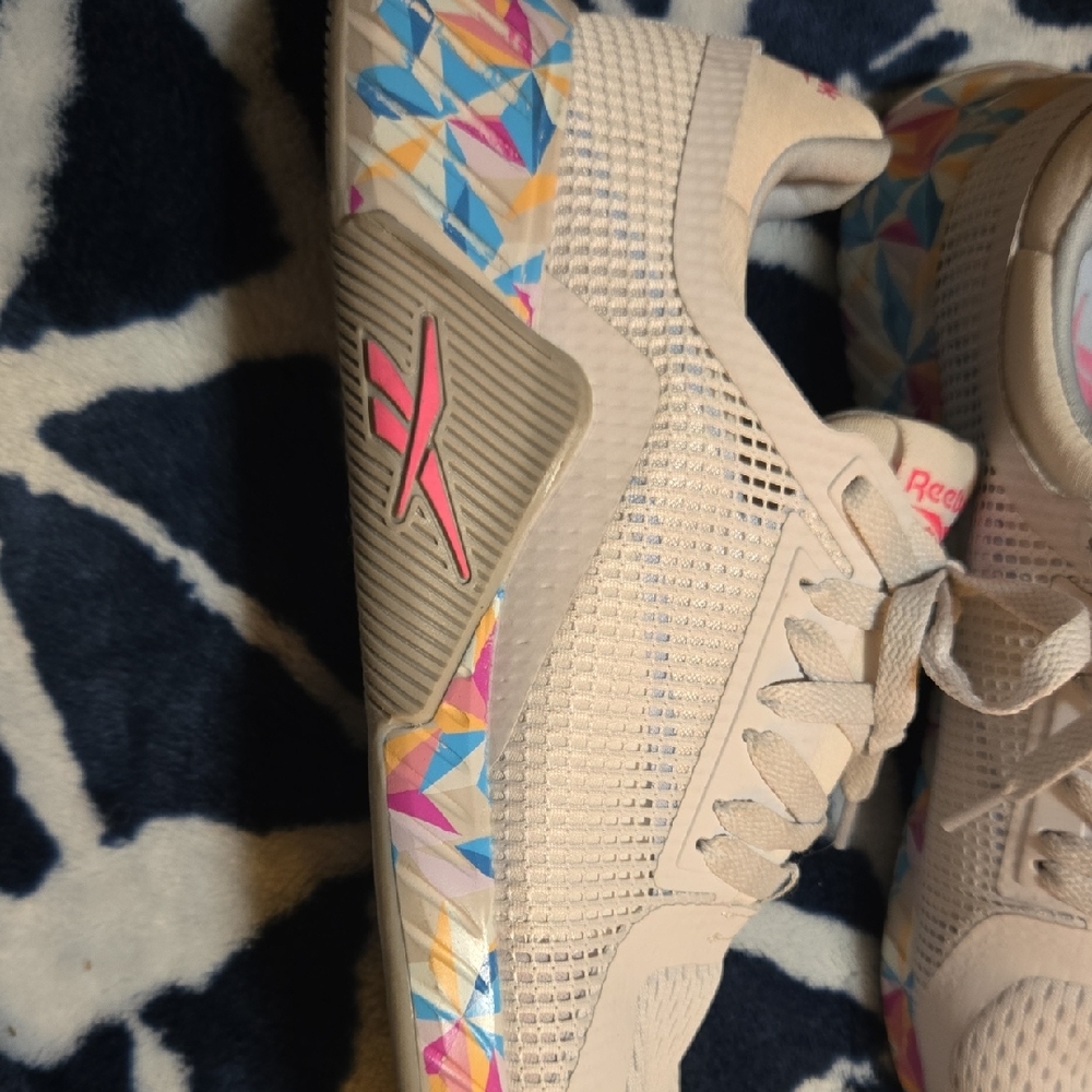 Reebok Cream and Pink Athletic Shoes with Modern Silhouette